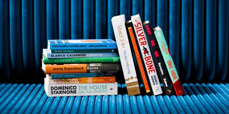 The International Booker Prize longlist books photographed stacked.